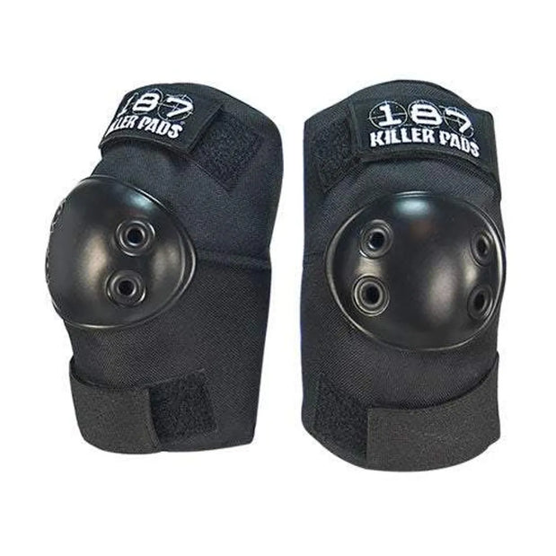 Pair of 187 Killer Pads Standard XS black elbow pads with hard caps, ventilation holes, straps, and white logos. - Longboards USA