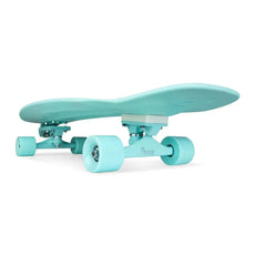 Original Penny Mint 29-inch surfskate skateboard with matching aqua deck, wheels and trucks, viewed from the side. - Longboards USA