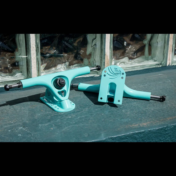Two Tiffany turquoise Paris V3 180mm 50-degree longboard trucks with black hardware, silver axles and logo details. - Longboards USA